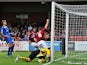 Lee Collins of Northampton Town celebrates scoring the first goal during the Sky Bet League Two match between AFC Wimbledon and Northampton Town at the Cherry Red Records Stadium on October 5, 2013