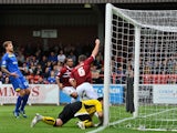 Lee Collins of Northampton Town celebrates scoring the first goal during the Sky Bet League Two match between AFC Wimbledon and Northampton Town at the Cherry Red Records Stadium on October 5, 2013