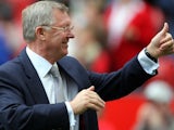 Sir Alex Ferguson salutes the Manchester United crowd after their win over Wigan Athletic in October 2007.