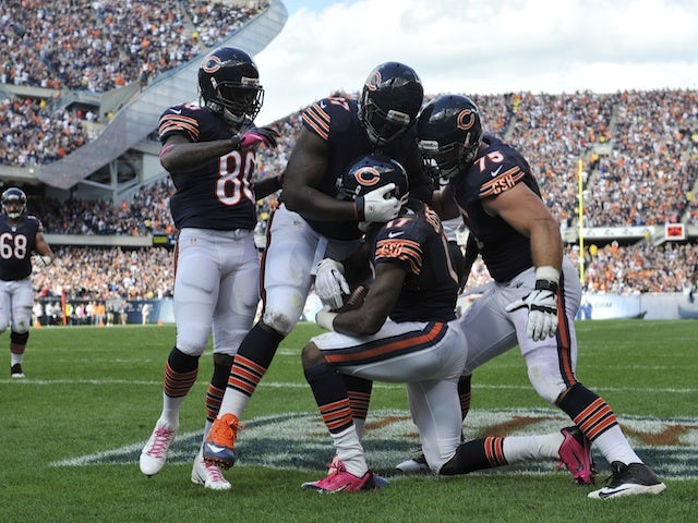 Alshon Jeffery of the Chicago Bears is congratulated after catching a touchdown against the New Orleans Saints on October 6, 2013