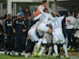 Marseille players celebrate following a goal by Andre Ayew during the French Ligue 1 match against PSG on October 6, 2013