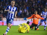 Wigan's Ben Watson celebrates after scoring his team's second goal against Maribor during their Europa League group match on October 3, 2013