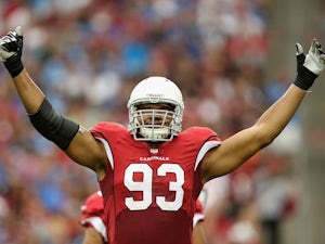 Calais Campbell works the crowd during the game between Arizona and Detroit on September 15, 2013