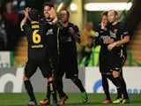 Barcelona's Cesc Fabregas celebrates with teammates after scoring the opening goal against Celtic during their Champions League group match on October 1, 2013