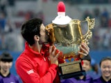 Novak Djokovic of Serbia poses for photographers after defeating Rafael Nadal of Spain during the final of the 2013 China Open at the National Tennis Center on October 6, 2013