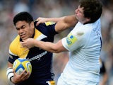 David Lemi of Worcester Warriors is tackled by Adam Powell of Newcatstle Falcons during the Aviva Premiership match between Worcester Warriors and Newcastle Falcons at Sixways Stadium on October 5, 2013