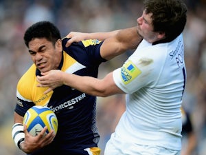 David Lemi of Worcester Warriors is tackled by Adam Powell of Newcatstle Falcons during the Aviva Premiership match between Worcester Warriors and Newcastle Falcons at Sixways Stadium on October 5, 2013