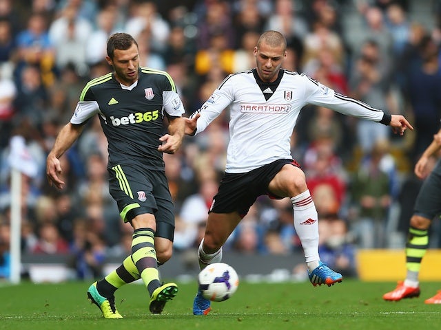 Stoke's Erik Pieters and Fulham's Pajtim Kasami battle for possession during their Barclays Premier League match at Craven Cottage on October 5, 2013