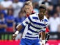 Gareth McCleary of Reading holds off the challenge of Elliot Hewitt of Ipswich during the Sky Bet Championship match between Reading and Ipswich Town at the Madejski Stadium on August 03, 2013