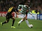 Celtic's Giorgos Samaras and Barcelona's Marc Bartra battle for the ball during their Champions League group match on October 1, 2013