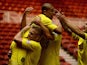 Huddersfield's James Vaughan celebrates with teammates after scoring the opening goal against Middlesbrough during their Championship match on October 1, 2013