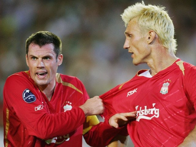 Jamie Carragher and Sami Hyypia discuss tactics during Liverpool's Champions League match with Real Betis in September 2005.
