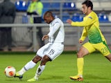 Tottenham's Jermain Defoe scores the opening goal against Anji Makhachkala during their Europa League group match on October 3, 2013