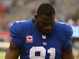 Giants defensive captain Justin Tuck leaves the field after defeat to the Philadelphia Eagles on October 6, 2013