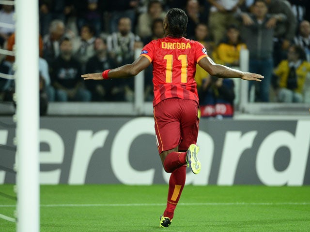 Galatasaray's forward Didier Drogba celebrates after scoring during the group B Champions League football match Juventus vs Galatasaray, on October 2, 2013