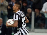 Arturo Vidal of Juventus celebrates after scoring his team's first goal from a penalty to equalise during the UEFA Champions League Group B match between Juventus and Galatasaray AS at Juventus Arena on October 2, 2013