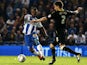 Brighton's Kazenga LuaLua and Wednesday's Lewis Buxton battle for the ball during their Championship match on October 1, 2013