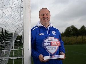 UNDER EMBARGO UNTIL 6AM 4/10/13: Rochdale boss Keith Hill with his September Manager of the Month award on October 3, 2013