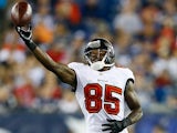Then Tampa Bay player Kevin Ogletree attempts to take a catch against the New England Patriots on August 16, 2013