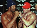British boxer Lennox Lewis squares up to Poland's Andrew Golota following their weigh-in in Atlantic City on October 2, 1997