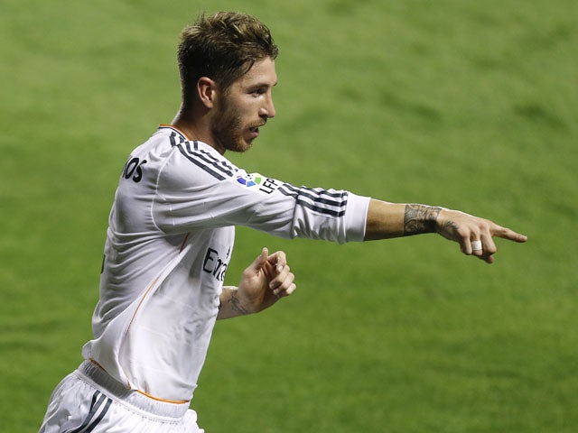 Real Madrid's defender Sergio Ramos celebrates after scoring during the Spanish league football match Levante UD vs Real Madrid CF at the Ciutat de Valencia stadium in Valencia on October 5, 2013