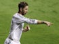 Real Madrid's defender Sergio Ramos celebrates after scoring during the Spanish league football match Levante UD vs Real Madrid CF at the Ciutat de Valencia stadium in Valencia on October 5, 2013