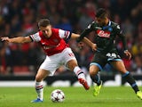 Napoli's Lorenzo Insigne and Arsenal's Aaron Ramsey battle for the ball during their Champions League match on October 1, 2013