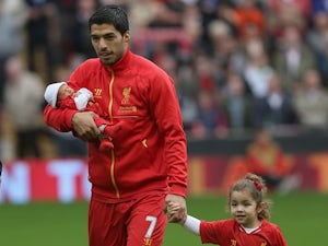 Liverpool's Luis Suarez parades children at Anfield