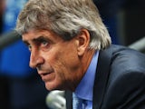 Manuel Pellegrini, coach of Manchester City looks on during the UEFA Champions League Group D match between Manchester City and FC Bayern Muenchen at Etihad Stadium on October 2, 2013