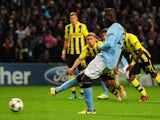 Mario Balotelli of Manchester City scores an equalising penalty kick during the UEFA Champions League Group D match between Manchester City and Borussia Dortmund at the Etihad Stadium on October 3, 2012