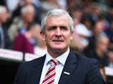 Stoke manager Mark Hughes stands on the touchline during the Barclays Premier League game with Fulham at Craven Cottage on October 5, 2013