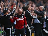 Fulham manager Martin Jol celebrates Darren Bent's winner against Stoke City in the Barclays Premier League match on October 5, 2013