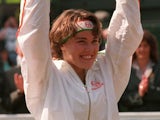 Martina Hingis celebrates after winning Wimbledon on July 5, 1997