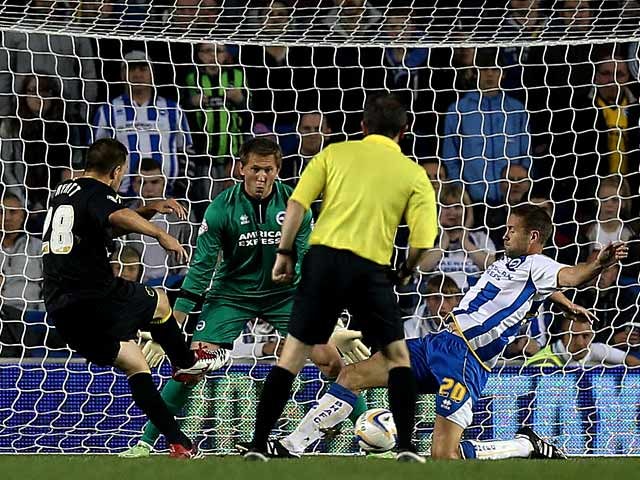 Wednesday's Matty Fryatt scores the opening goal against Brighton during their Championship match on October 1, 2013