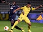 Bordeaux's Maxime Poudje and Maccabi's Barak Itzhaki battle for the ball during their Europa League group match on October 3, 2013