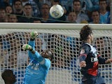 Paris Saint-Germain defender Maxwell heads the ball and scores against Marseille during the Ligue 1 match on October 6, 2013