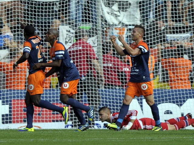 Montpellier's players celebrate after scoring during the French L1 football match Montpellier vs Lyon on October 6, 2013