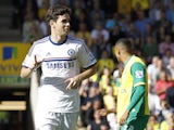 Chelsea's Brazilian midfielder Oscar celebrates scoring his goal during the English Premier League football match between Norwch City and Chelsea at Carrow Road in Norwich on October 6, 2013