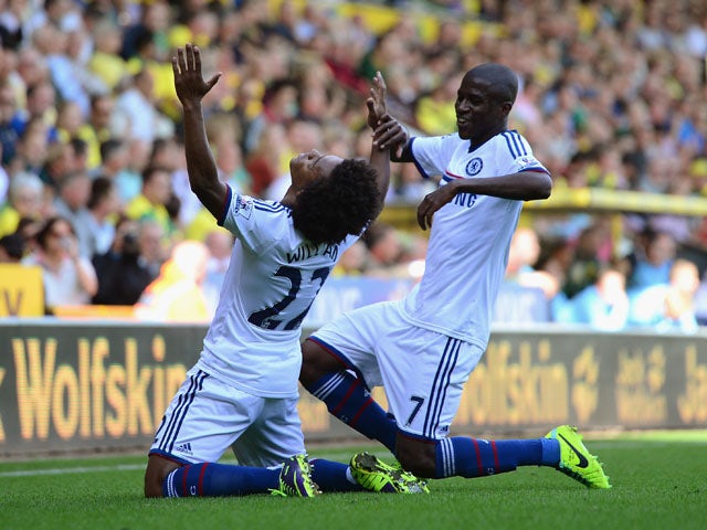 Willian of Chelsea celebrates scoring their third goal with Ramires of Chelsea during the Barclays Premier League match between Norwich City and Chelsea at Carrow Road on October 6, 2013