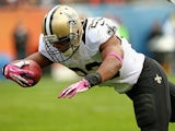 New Orleans Saints' Pierre Thomas dives into the end zone to score a touchdown against the Chicago Bears at Soldier Field on October 6, 2013
