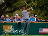 Tiger Woods of the U.S. Team watches his tee shot on the fourth hole during the Day Two Foursome Matches at the Muirfield Village Golf Club on October 4, 2013