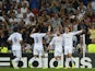 Real Madrid's Portuguese forward Cristiano Ronaldo celebrates with teammates after scoring during the UEFA Champions League Group B football match Real Madrid CF vs FC Copenhagen on October 2, 2013