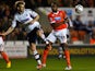 Blackpool's Ricardo Fuller and Bolton's Tim Ream battle for the ball during their Championship match on October 1, 2013