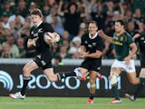 Beuden Barrett of the All Blacks breaks clear to score the bonus point winning fourth try during the Rugby Championship match between South Africa Springboks and the New Zealand All Blacks at Ellis Park on October 5, 2013