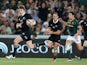 Beuden Barrett of the All Blacks breaks clear to score the bonus point winning fourth try during the Rugby Championship match between South Africa Springboks and the New Zealand All Blacks at Ellis Park on October 5, 2013