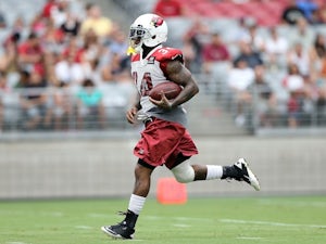 Cardinals RB Ryan Williams carries the ball at practice on July 26, 2013
