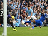 Manchester City's Sergio Aguero fires the ball past Tim Howard of Everton, during the game on October 5, 2013