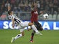 Simone Padoin of Juventus competes for the ball with Kevin Constant of AC Milan during the Serie A match on October 6, 2013