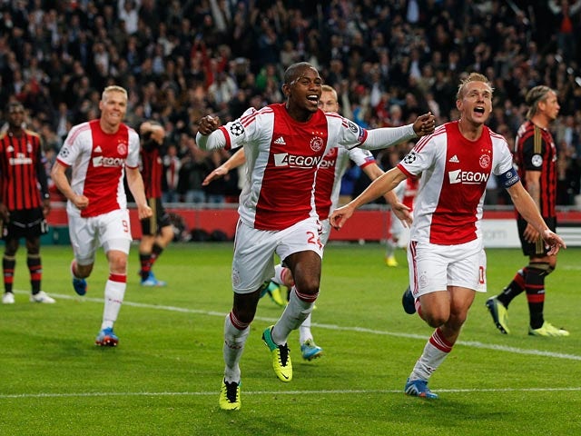 Ajax's Stefano Denswil celebrates after scoring the opening goal against AC Milan during their Champions League group match on October 1, 2013