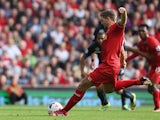 Liverpool captain Steven Gerrard strikes to score a penalty against Crystal Palace during the Barclays Premier League match on October 5, 2013
